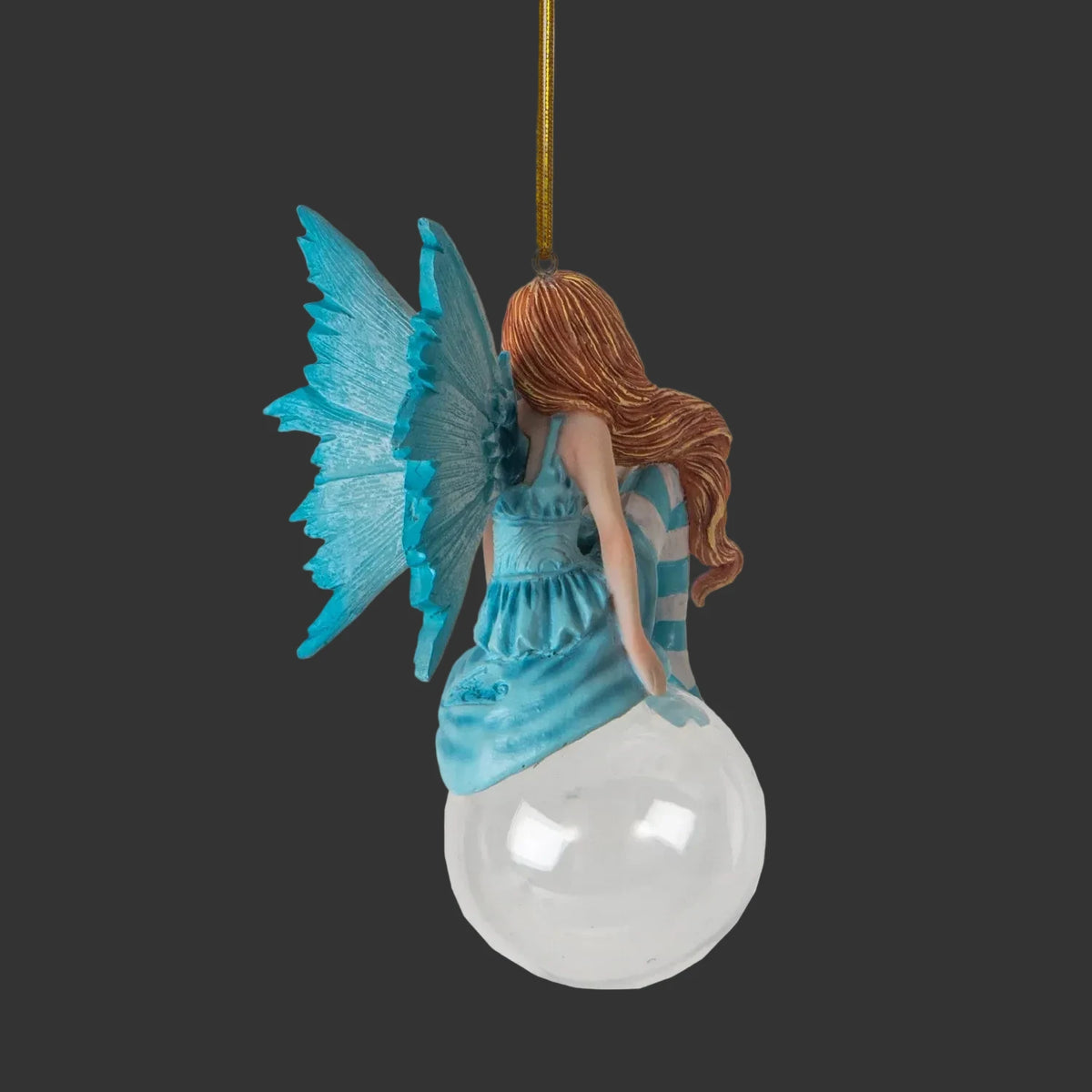 Amy Brown hanging Fairy christmas tree ornament with blue wings and dress on a black background