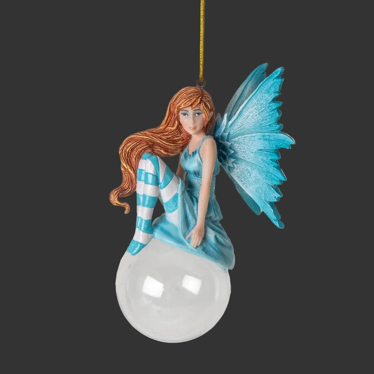 Amy Brown Fairy holiday hanging ornament with blue wings and striped dress on a black background