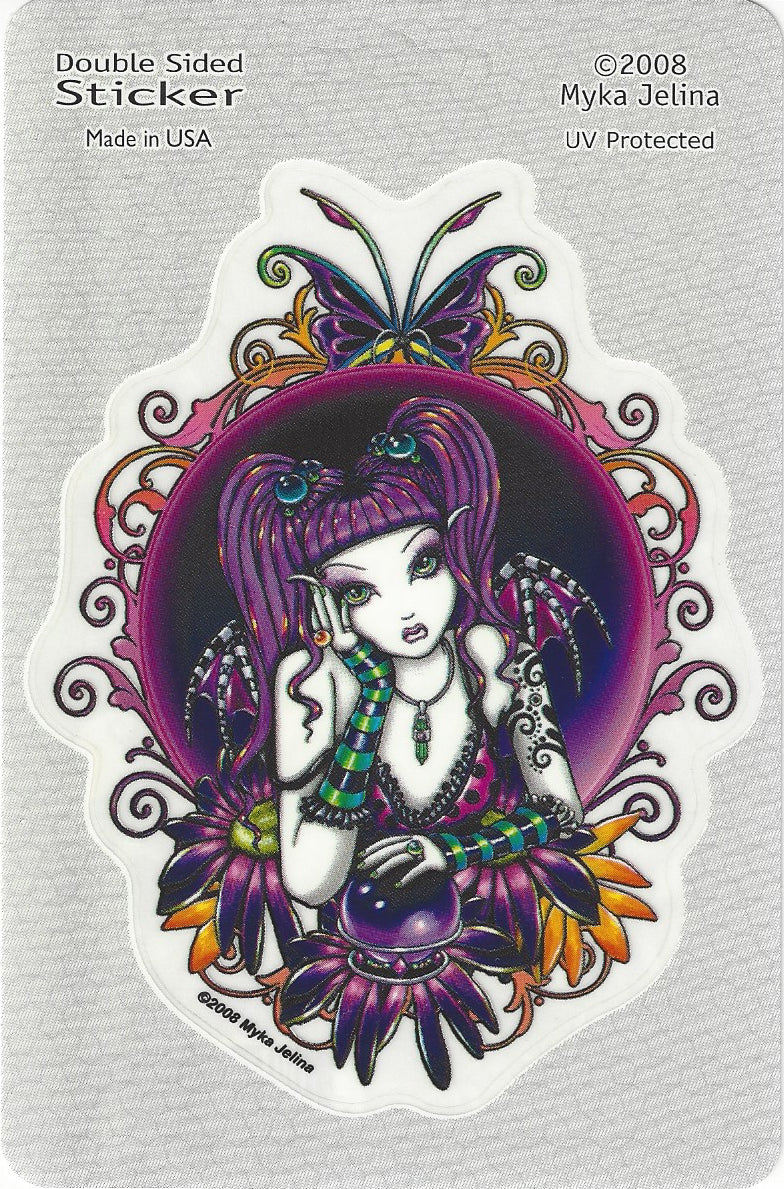 A double-sided sticker featuring an illustrated fantasy character with purple hair, a purple crystal ball, and ornate purple, black, green, and orange decorative elements, shown on a light gray backing card.