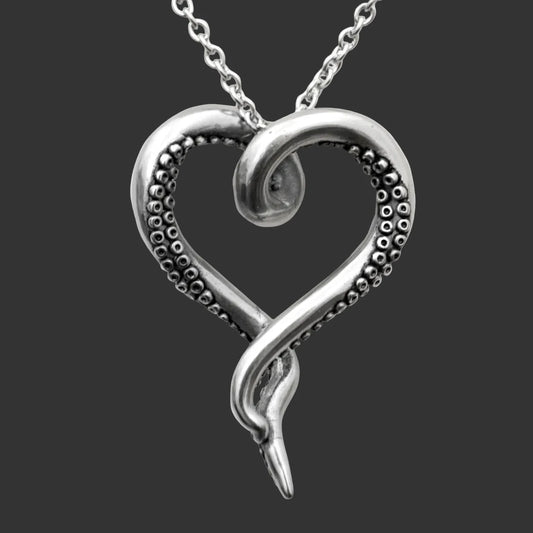 Controse octopus heart medallion stainless steel necklace with tentacle detail on a black background