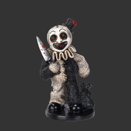 Creeptoons Pinhead Monster figurine of Art the Clown from Terrifier reimagined with a wide painted grin, black and white costume, and holding a small knife on a black background