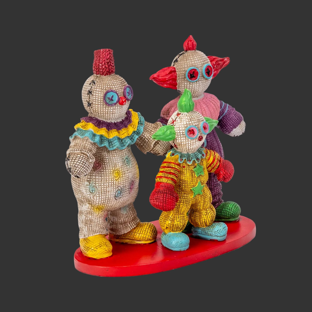 Side angle view of Killer Klowns from Outer Space Pinhead Monster figurine set showing Slim and Shorty detail, hand-painted resin collectible by Ruben Macias, black background