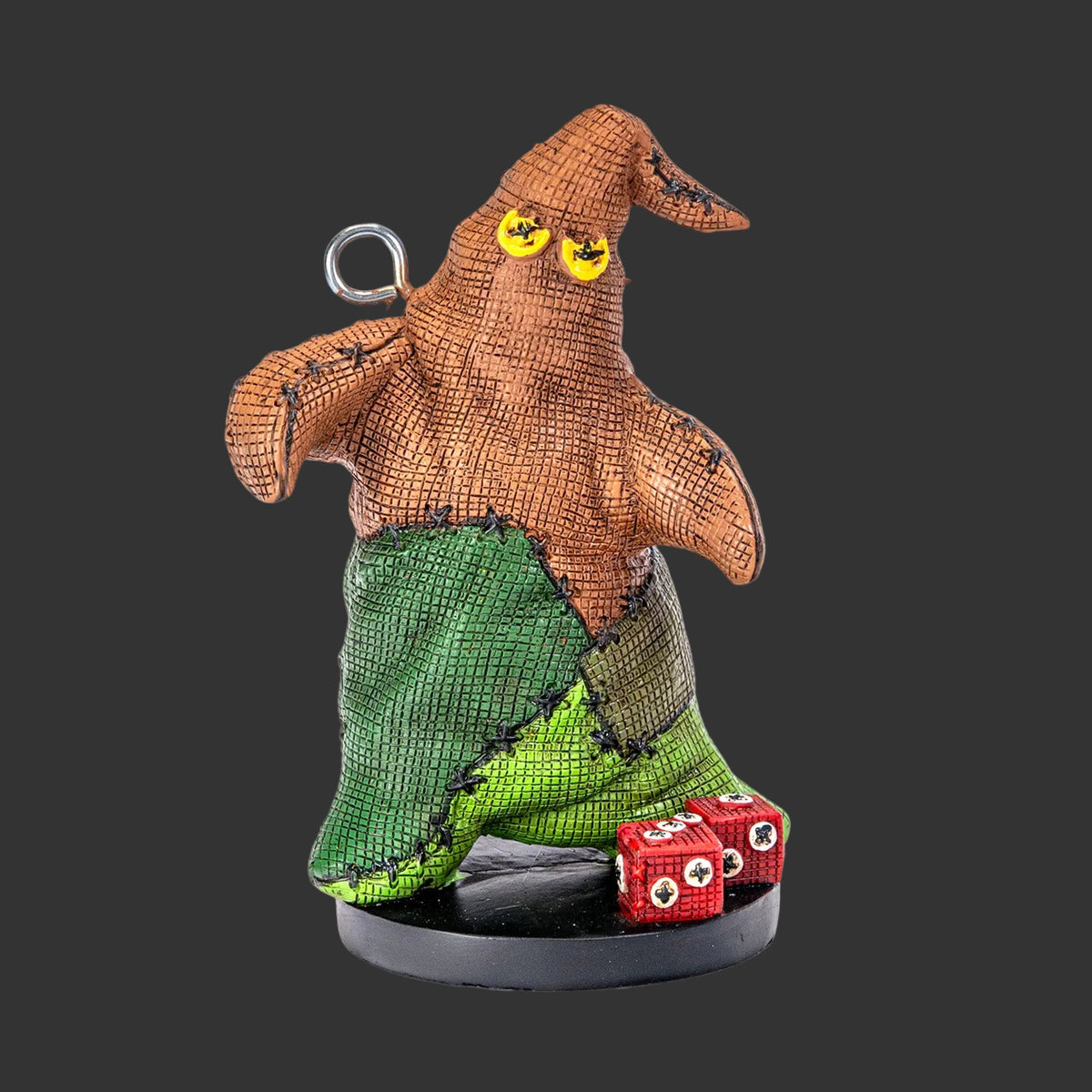 Oogie Boogie Pinhead Monster figurine and ornament by Ruben Macias, creepy cute hand-painted resin collectible with yellow eyes and red dice, Nightmare Before Christmas horror collectible, white background