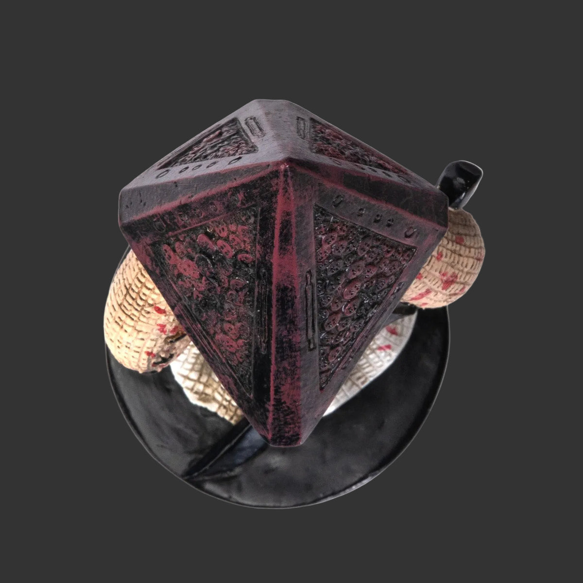 Pinhead Monster Collectible Horror Character Pyramid with Pyramid Shaped Helmut, white clock holding a sword on a plain black background