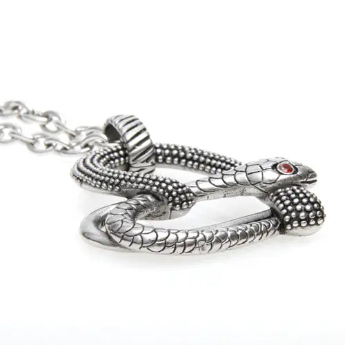A silver-toned snake pendant necklace with a textured beaded pattern, a small red eye detail, and a matching chain on a white background.