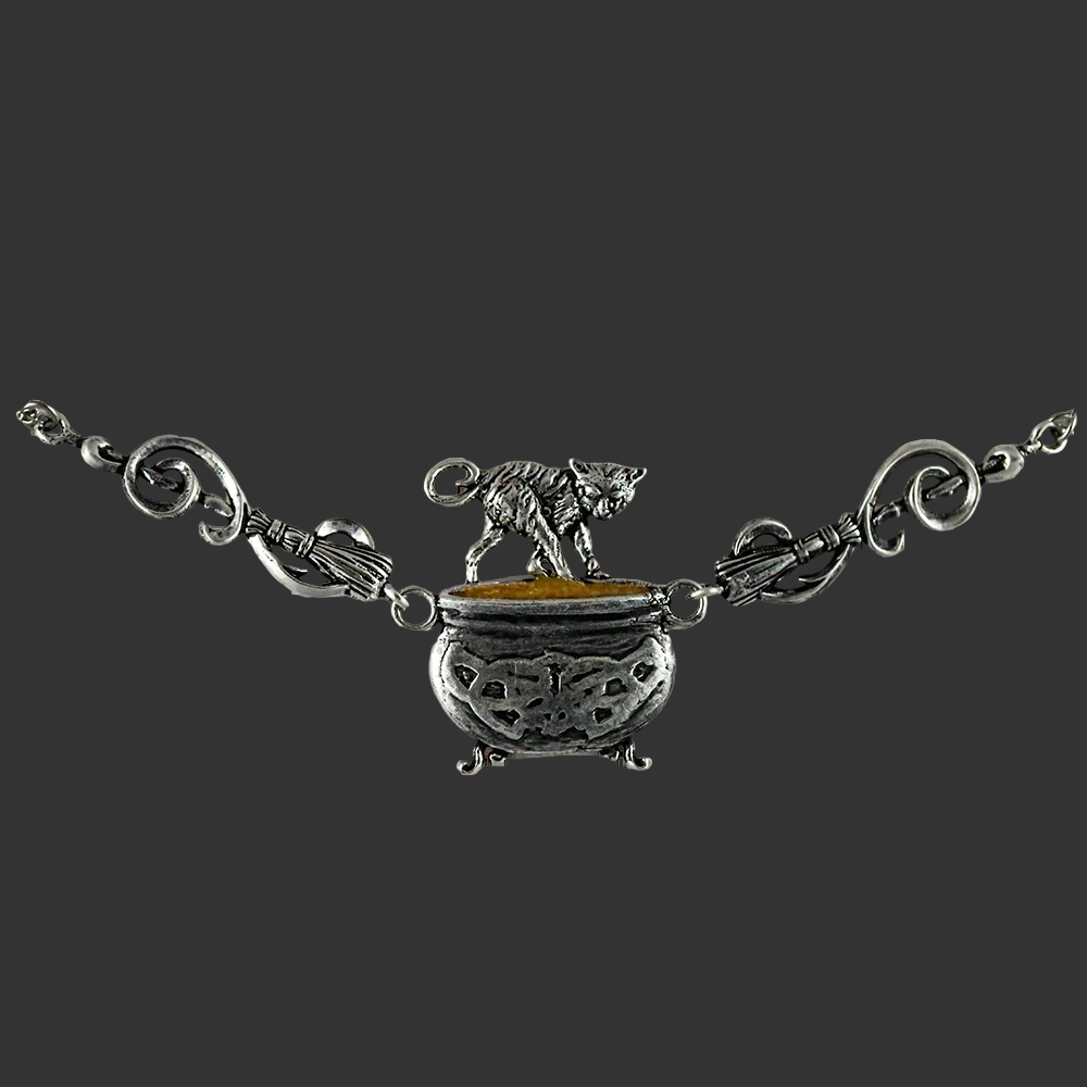 Cauldron Cat witch necklace in fine English pewter showing cat perched on cauldron pendant with broomstick chain links on a dark background