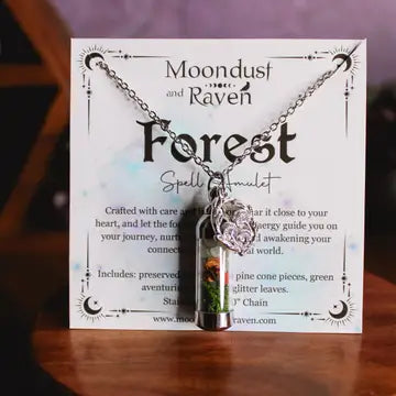 Spell Jar Forest Necklace with pendant on a display card featuring 'Moondust and Raven' branding.