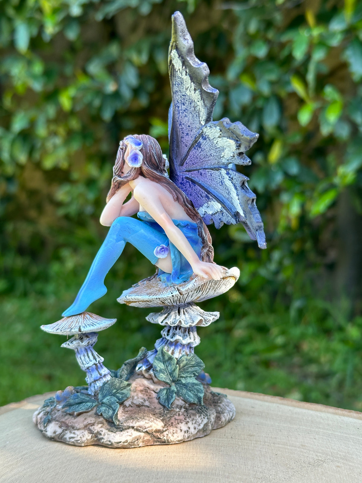 Amy Brown Nice Fairy figurine left side view, fantasy fae collectible with blue dress and mushroom base