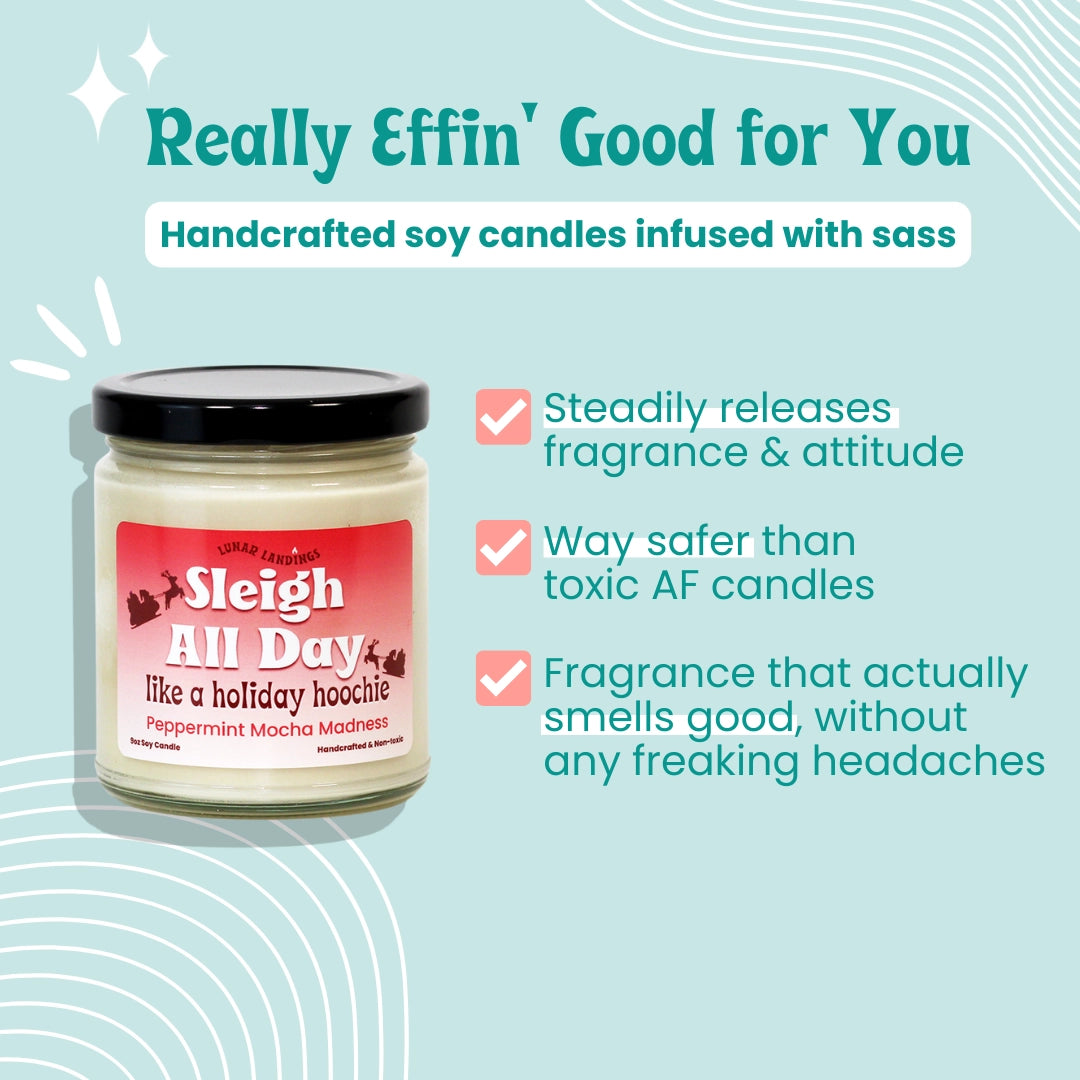 A jar candle labeled 'Sleigh All Day' on a light blue promotional background with marketing text about handcrafted soy candles infused with sass and benefit claims.