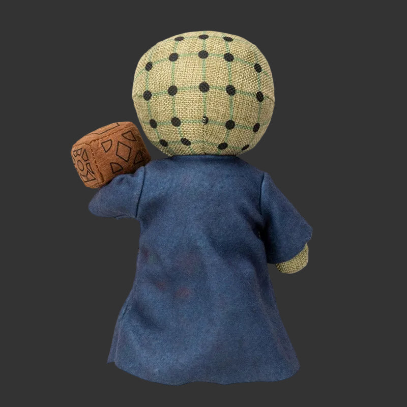 Back view of a Pinhead Monster Plush  wearing a blue dress and plaid hat on a white 