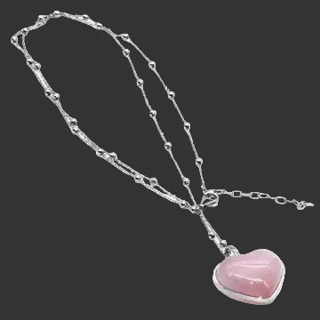 Cat eye heart gemstone necklace in pink with beaded satellite chain on a black background