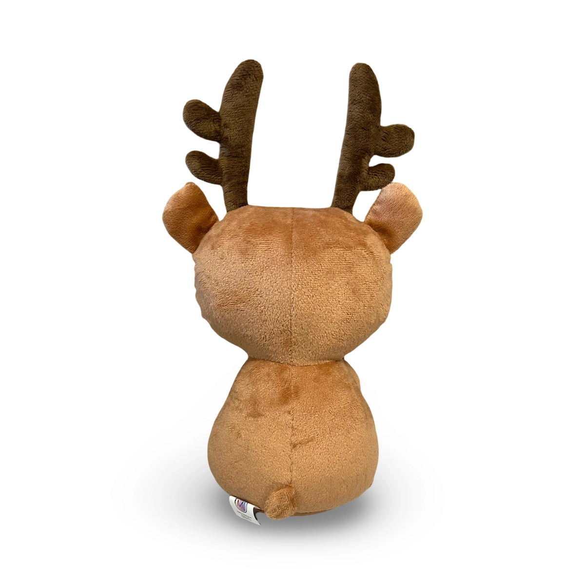 Plush toy ginger dead reindeer backside with brown plush and dark brown antlers on a white background